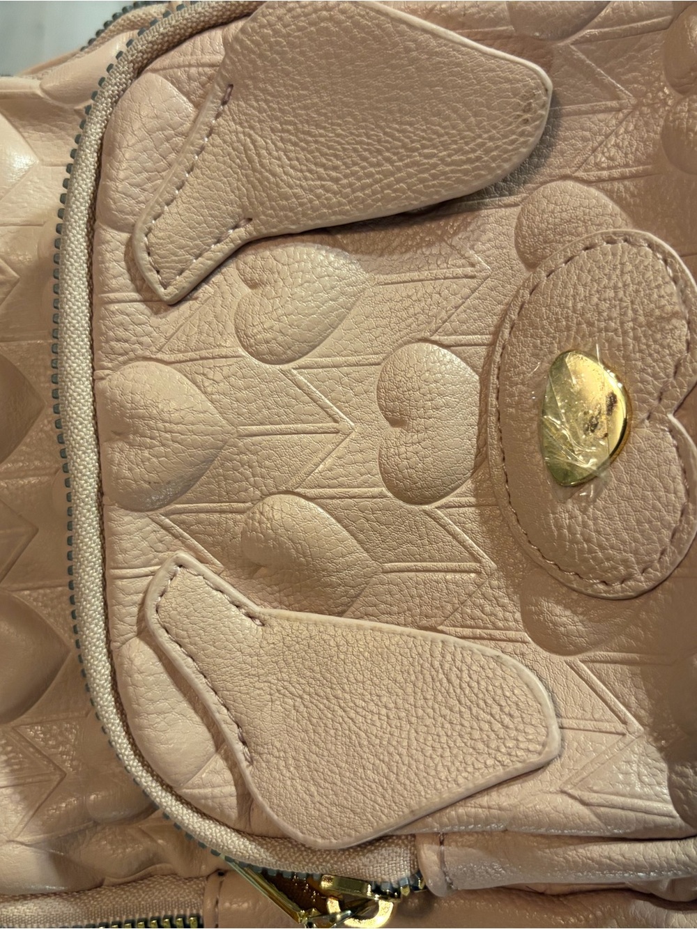 Mini Heart-Embossed Beige Backpack with Gold Hardware